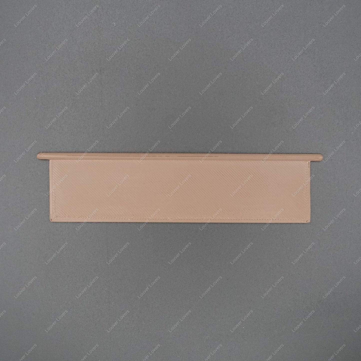 This is a photo of a 4 1/16" wide 1 1/16" tall brown colored vent slat with a black background.