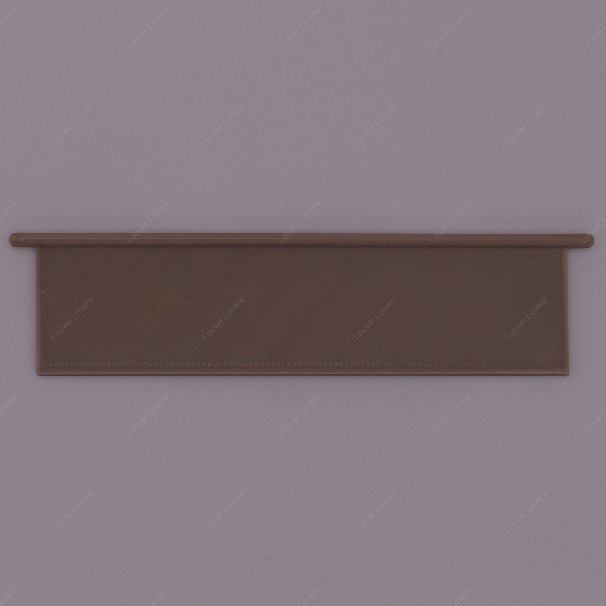 This is a photo of a 4 1/16" wide 1 1/16" tall dark beige colored vent slat with a white background.