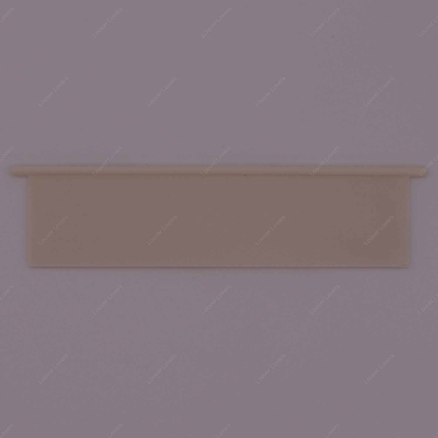 This is a photo of a 4 1/16" wide 1 1/16" tall natural colored vent slat with a white background.