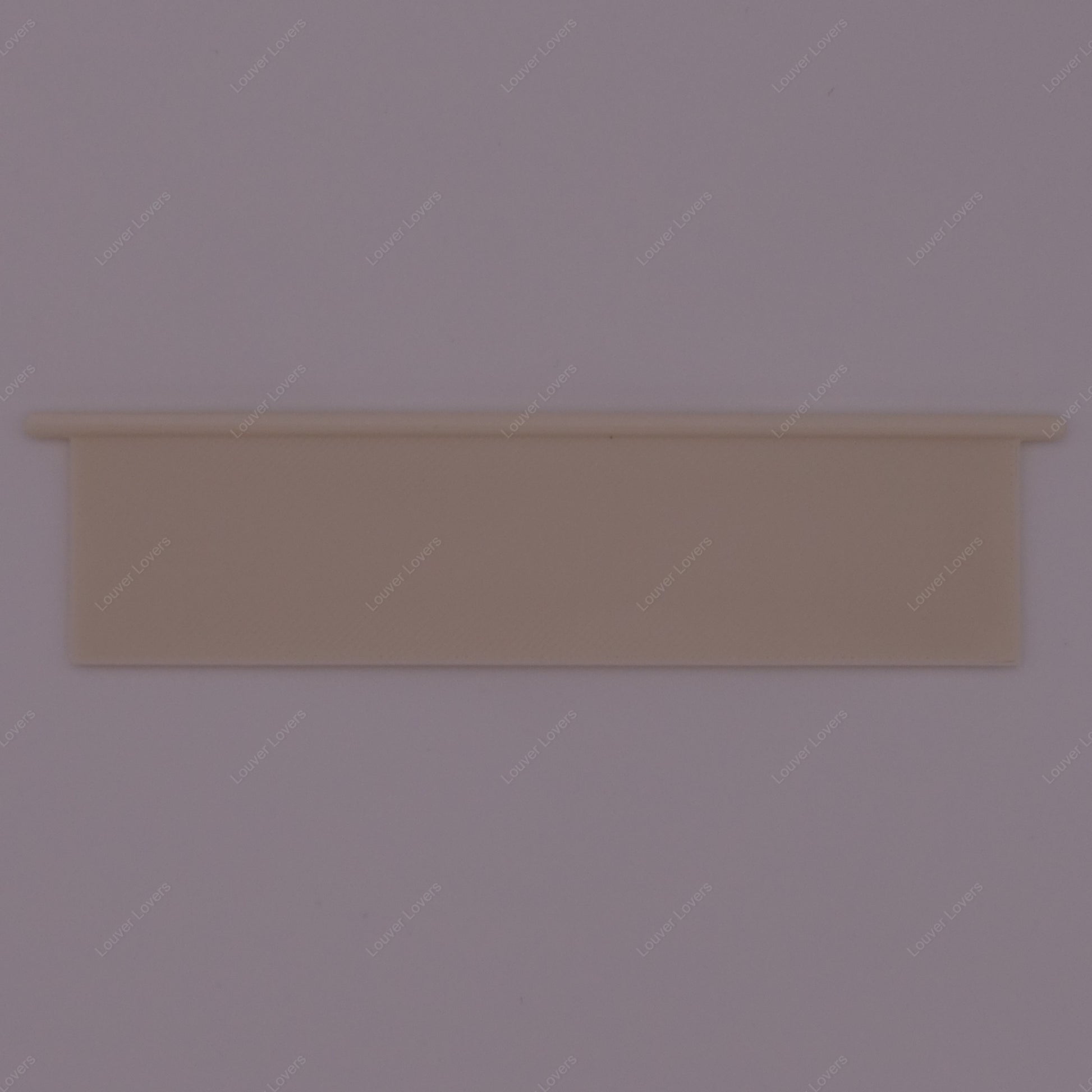 This is a photo of a 4 1/16" wide 1 1/16" tall natural colored vent slat with a white background.
