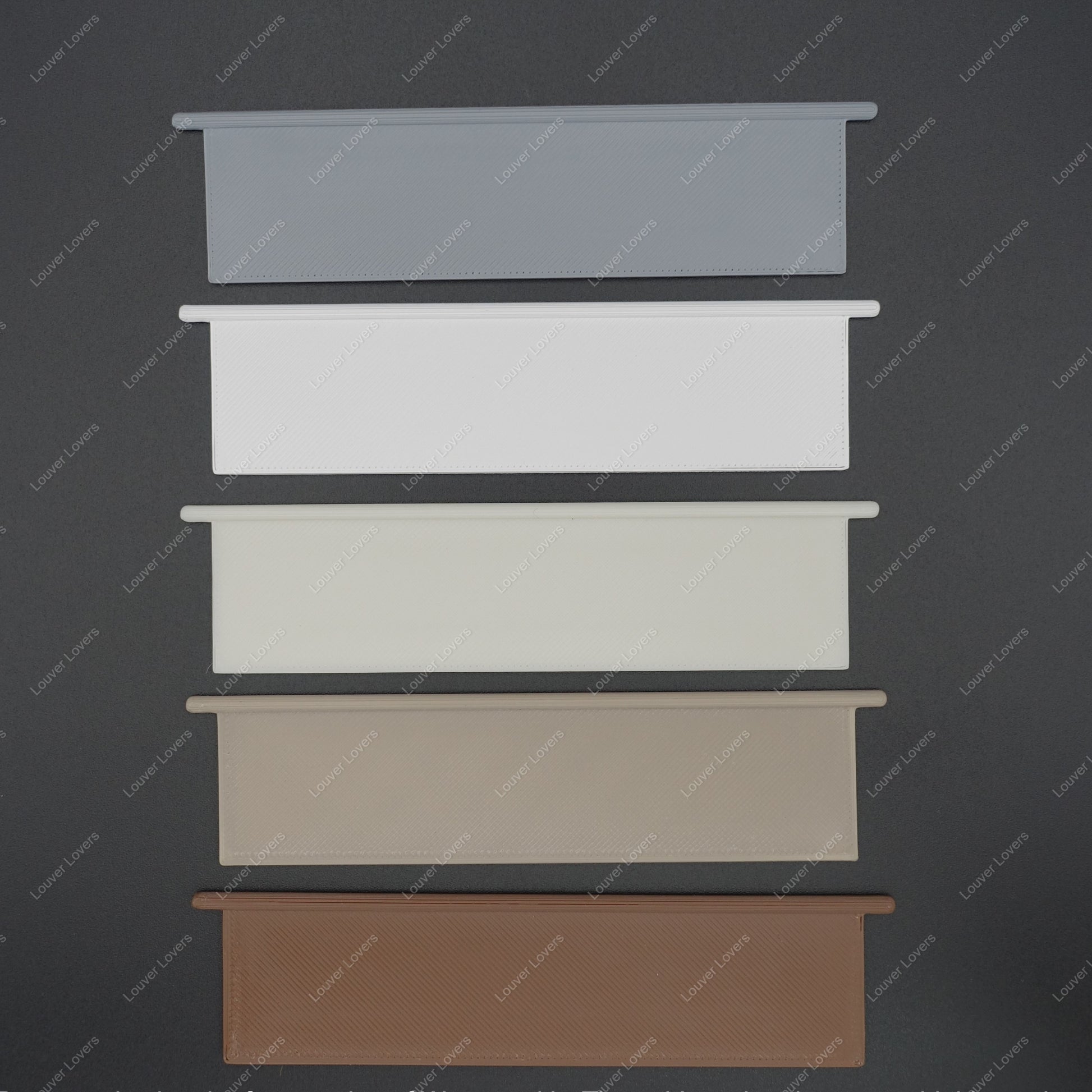 This is a photo of the 4 1/16" wide 1 1/16" tall vent slat in all available colors with a black background.