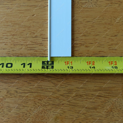 This is a photo of a 4 1/16" wide 1 1/16" tall white colored vent slat with a tape measure placed next to it to show height.